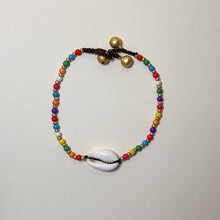 Load image into Gallery viewer, Colorful beaded bracelet with a cowrie shell on a light gray background
