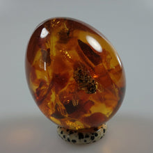 Load image into Gallery viewer, Egg made from amber in resin
